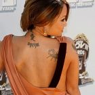 Tila Tequila - napis na plecach - tuż obok skorpiona